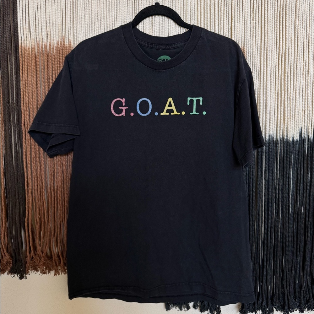 Black graphic tee with multi-coloured GOAT design; excellent condition